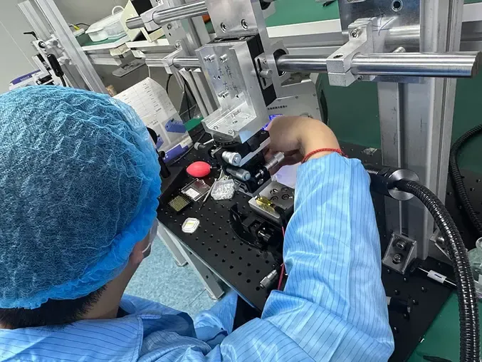 ERDI technician performing optical alignment and module verification